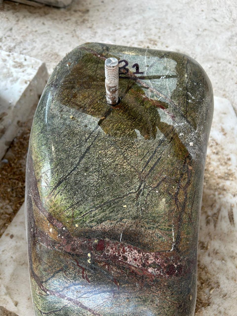 Marble support face marked B1 with a projecting metal pin
